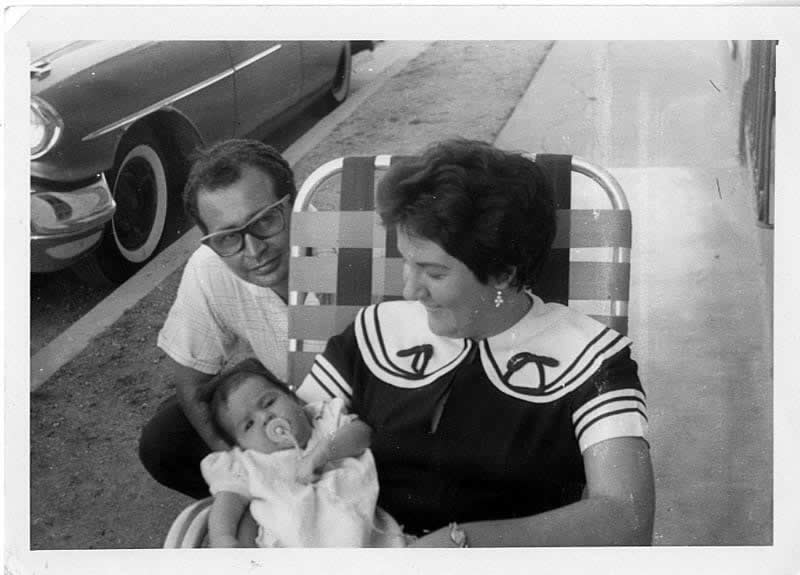 Liz as an infant in Puerto Padre, Cuba, with mom, Ada, and dad, Eduardo, just weeks before they left for their new life in Miami, 1959